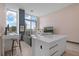 Open living area with modern kitchen and balcony at 5120 Marina Way # 112, Tampa, FL 33611