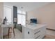 Open living room features modern kitchen island, sleek workspace, and comfortable seating at 5120 Marina Way # 112, Tampa, FL 33611