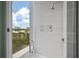 Modern shower with glass enclosure and window at 5120 Marina Way # 112, Tampa, FL 33611