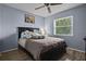 Bedroom with a double bed and light-colored walls at 5705 Carrollwood Meadows Dr, Tampa, FL 33625