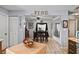 View of kitchen and dining room with wood flooring and island at 5705 Carrollwood Meadows Dr, Tampa, FL 33625