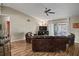 Living room with leather sofas, wood floors, and access to a patio at 5705 Carrollwood Meadows Dr, Tampa, FL 33625