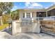 Stainless steel grill and prep station with stonework at 6099 Summit View Dr, Brooksville, FL 34601