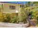 Landscaped walkway leading to mid-century modern home at 711 Pinellas Point S Dr, St Petersburg, FL 33705