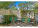 Relaxing patio with two chairs and small table at 711 Pinellas Point S Dr, St Petersburg, FL 33705