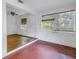 Living room with hardwood floors and tiled area at 8101 Country Club N Rd, St Petersburg, FL 33710