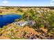 Aerial view of house and property by lake at 9602 Ripley Rd, Thonotosassa, FL 33592