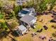 Aerial view of a property with two houses, a large backyard, and a detached garage at 9602 Ripley Rd, Thonotosassa, FL 33592