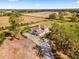 Aerial view of house, expansive lot, and surrounding pasture at 9606 Ripley Rd, Thonotosassa, FL 33592