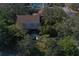 Aerial view of a two-story house with a deck at 1149 Sedeeva St, Clearwater, FL 33755