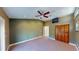 Bedroom featuring plush carpeting, a closet and a ceiling fan at 1149 Sedeeva St, Clearwater, FL 33755