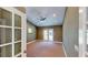 Neutral bedroom with a ceiling fan and access to a private balcony at 1149 Sedeeva St, Clearwater, FL 33755