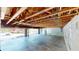 A large garage with exposed wood rafters, cinder block walls, and ample unfinished space at 1149 Sedeeva St, Clearwater, FL 33755