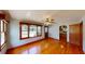 Cozy living room with hardwood floors, ceiling fan, and natural light at 1149 Sedeeva St, Clearwater, FL 33755