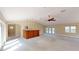 Spacious living room with a wet bar, vaulted ceilings and carpet floors at 1149 Sedeeva St, Clearwater, FL 33755
