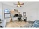 Home office/bedroom combo with wood-style floors and ceiling fan at 11926 Cinnamon Fern Dr, Riverview, FL 33579