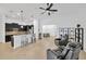 Open kitchen boasts sleek, black cabinets, stainless steel appliances, and a breakfast bar for casual dining at 11926 Cinnamon Fern Dr, Riverview, FL 33579