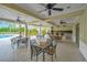 Covered outdoor kitchen and dining area by the pool at 11926 Cinnamon Fern Dr, Riverview, FL 33579