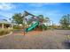 Community playground with shade cover and slides at 11926 Cinnamon Fern Dr, Riverview, FL 33579