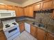 Kitchen with granite countertops and wood cabinets at 121 Pershing Ne St, St Petersburg, FL 33702