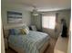 Bright bedroom with a comfortable bed and ocean-themed art at 1616 70Th N St # 1616, St Petersburg, FL 33710