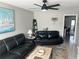 Living room with comfortable black leather couches and coffee table at 1616 70Th N St # 1616, St Petersburg, FL 33710