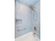 Updated shower showcasing a rainfall shower head, tiled walls, and a recessed shelf at 1860 N Fort Harrison Ave # 104, Clearwater, FL 33755