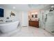 Spa-like bathroom featuring a large soaking tub and walk-in shower at 1860 N Fort Harrison Ave # 104, Clearwater, FL 33755