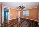 Spacious bedroom with hardwood floors, a ceiling fan, and a window with a water view at 1860 N Fort Harrison Ave # 104, Clearwater, FL 33755