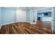 Spacious bonus room featuring hardwood flooring, and a kitchen view at 1860 N Fort Harrison Ave # 104, Clearwater, FL 33755