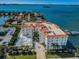 Waterfront building showcasing stunning water views, multiple docks and beautiful landscaping all around at 1860 N Fort Harrison Ave # 104, Clearwater, FL 33755