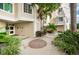 Attractive condo complex highlighting landscaping, with tropical trees, plants, and walkways at 1860 N Fort Harrison Ave # 104, Clearwater, FL 33755