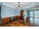 Bright wet bar with wood floors, sleek cabinets, and wine storage at 1860 N Fort Harrison Ave # 104, Clearwater, FL 33755