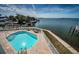 The waterfront pool is surrounded by a fence and has access to the ocean at 1860 N Fort Harrison Ave # 104, Clearwater, FL 33755