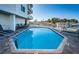 Community pool with ample deck space and lounge chairs at 1860 N Fort Harrison Ave # 104, Clearwater, FL 33755