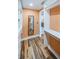 Walk-in closet with hardwood floors, built in shelves and drawers, and a long mirror at 1860 N Fort Harrison Ave # 104, Clearwater, FL 33755