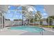 Relaxing screened-in pool area with lounge chairs at 1932 Brainerd Ct, Lutz, FL 33549