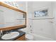 Bathroom with shower/tub combo, vanity and toilet at 211 Arlington E Ave, Oldsmar, FL 34677