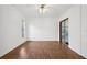 Bright bedroom with wood-look floors and a large window at 211 Arlington E Ave, Oldsmar, FL 34677