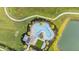 Aerial view of community pool and surrounding landscape at 2185 Hallier Cv, Wesley Chapel, FL 33543