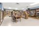 Well-stocked library featuring shelves full of books and a large table with chairs for reading at 2256 Philippine Dr # 56, Clearwater, FL 33763