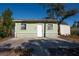 Light green house exterior with small front yard at 3811 18Th S Ave, St Petersburg, FL 33711