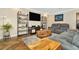 Spacious living room with gray sofas and herringbone wood floors at 3923 Applegate Cir, Brandon, FL 33511