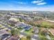 Aerial view showcasing a house's location in a residential area at 4005 Langdrum Dr, Wesley Chapel, FL 33543