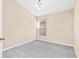 Simple bedroom with grey carpeting and a window at 4005 Langdrum Dr, Wesley Chapel, FL 33543