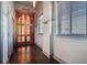 Hallway featuring a stained-glass door and wood floors at 405 Central Ave # 700, St Petersburg, FL 33701