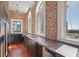 Modern kitchen with dark cabinetry, concrete counters, and exposed brick walls at 405 Central Ave # 700, St Petersburg, FL 33701