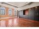 Open living area with hardwood floors and exposed brick walls at 405 Central Ave # 700, St Petersburg, FL 33701