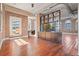 Open living area with hardwood floors and exposed brick walls at 405 Central Ave # 700, St Petersburg, FL 33701