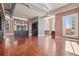 Spacious living room with exposed brick, hardwood floors, and built-in storage at 405 Central Ave # 700, St Petersburg, FL 33701